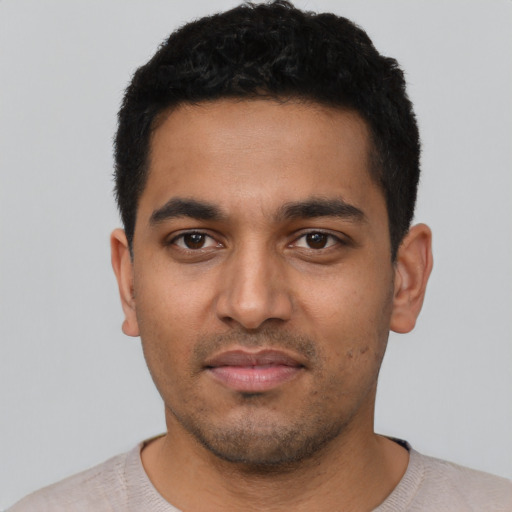 Neutral latino young-adult male with short  black hair and brown eyes