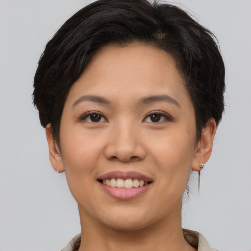 Joyful white young-adult female with short  brown hair and brown eyes