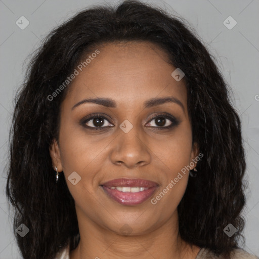 Joyful black young-adult female with long  brown hair and brown eyes