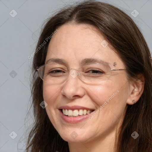 Joyful white adult female with long  brown hair and brown eyes