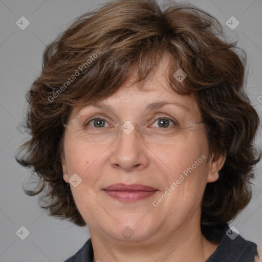 Joyful white adult female with medium  brown hair and blue eyes