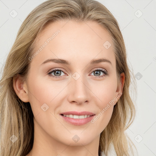 Joyful white young-adult female with long  brown hair and blue eyes