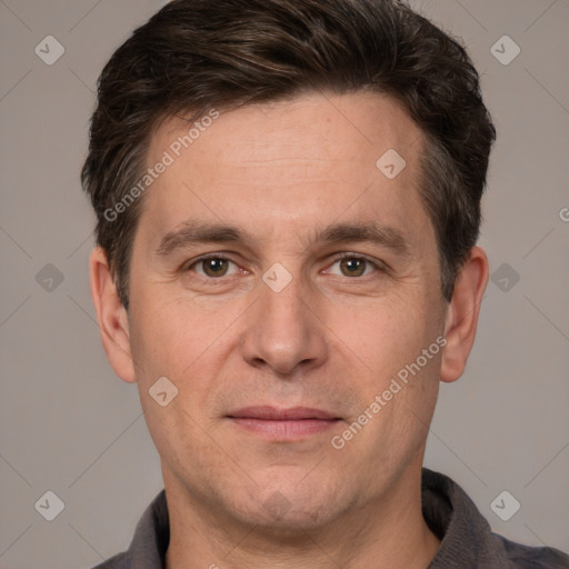 Joyful white adult male with short  brown hair and grey eyes