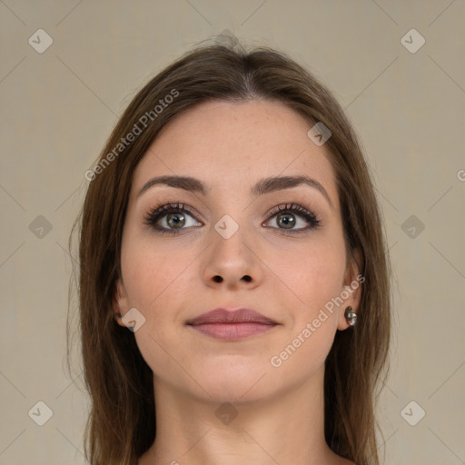 Joyful white young-adult female with long  brown hair and green eyes