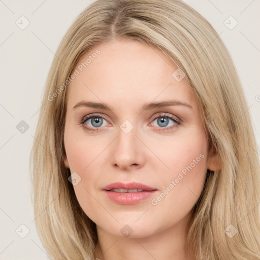 Joyful white young-adult female with long  brown hair and blue eyes