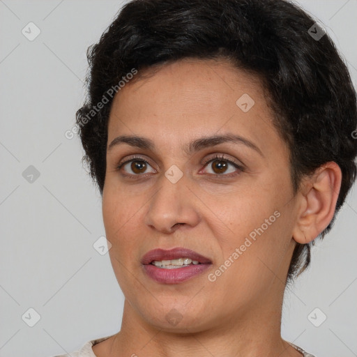 Joyful white adult female with short  brown hair and brown eyes