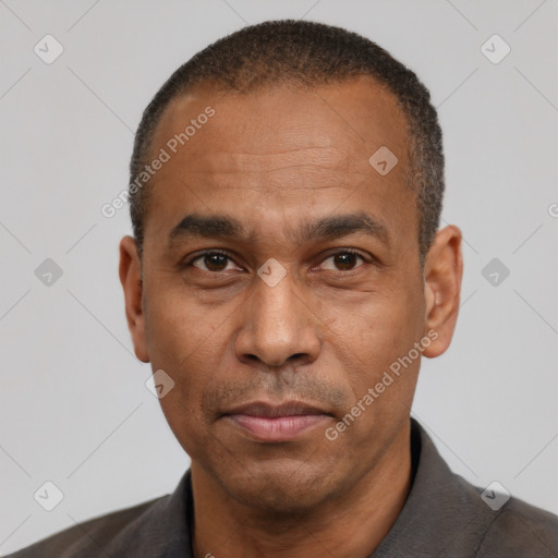 Neutral latino adult male with short  black hair and brown eyes