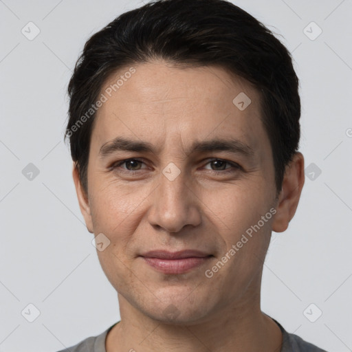 Joyful white adult male with short  brown hair and brown eyes