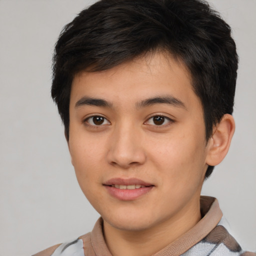 Joyful asian young-adult male with short  brown hair and brown eyes