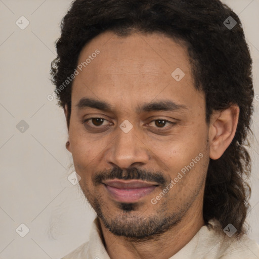 Joyful black adult male with short  black hair and brown eyes
