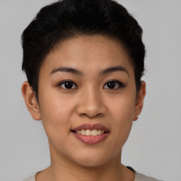 Joyful asian young-adult female with short  black hair and brown eyes