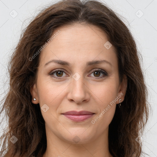 Joyful white adult female with long  brown hair and brown eyes