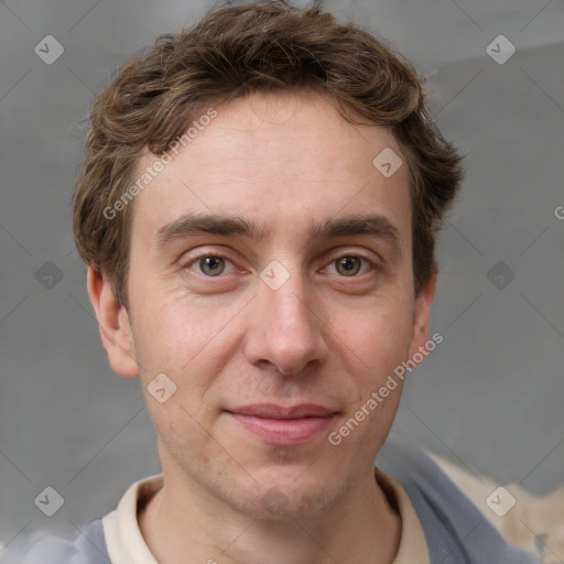 Joyful white adult male with short  brown hair and grey eyes