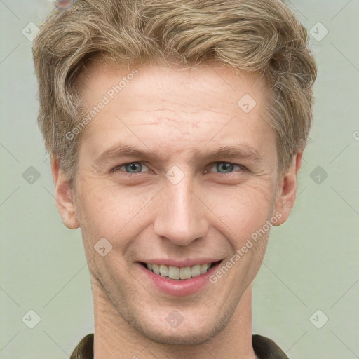 Joyful white adult male with short  brown hair and grey eyes