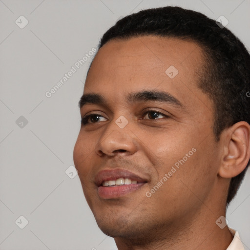 Joyful white young-adult male with short  black hair and brown eyes