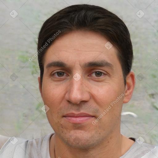 Joyful white adult male with short  brown hair and brown eyes