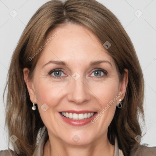 Joyful white adult female with medium  brown hair and grey eyes