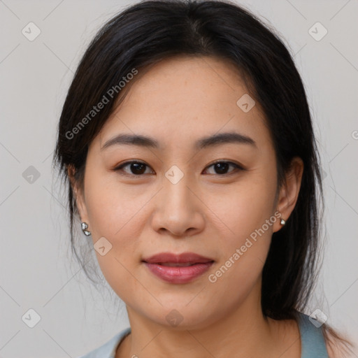 Joyful asian young-adult female with medium  brown hair and brown eyes