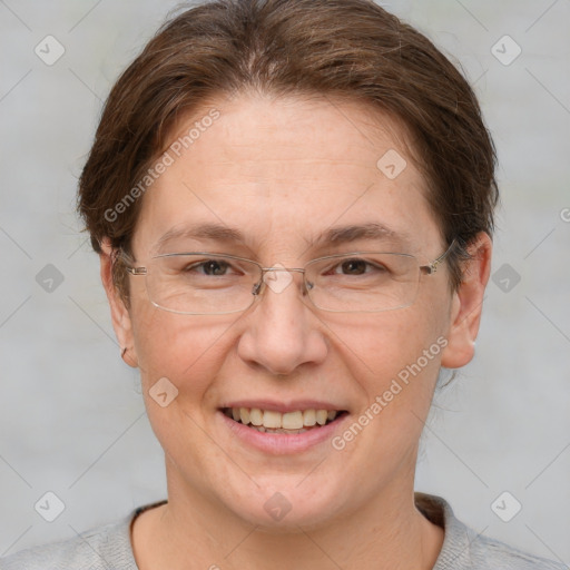 Joyful white adult female with short  brown hair and grey eyes