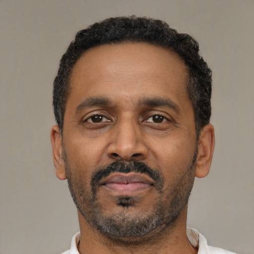 Neutral latino adult male with short  black hair and brown eyes
