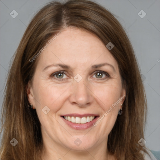 Joyful white adult female with medium  brown hair and grey eyes