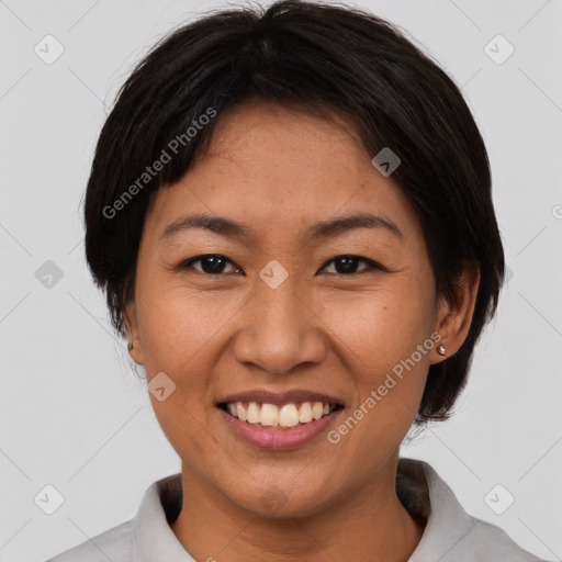 Joyful asian young-adult female with short  brown hair and brown eyes