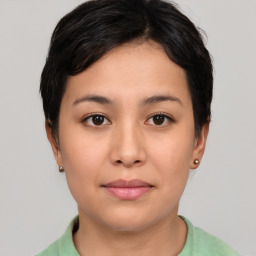 Joyful asian young-adult female with short  black hair and brown eyes