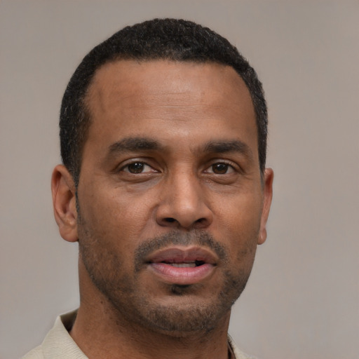 Neutral latino young-adult male with short  brown hair and brown eyes