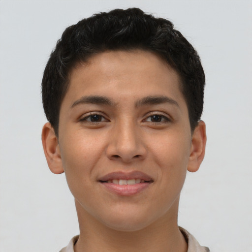 Joyful latino young-adult male with short  brown hair and brown eyes
