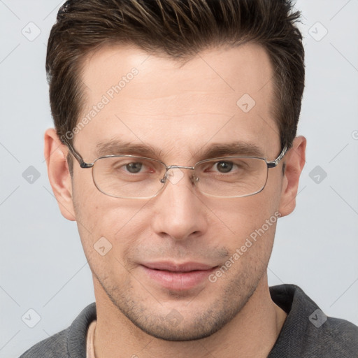 Joyful white adult male with short  brown hair and grey eyes