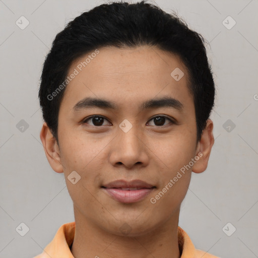 Joyful latino young-adult male with short  black hair and brown eyes