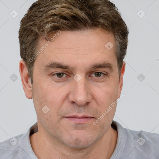 Joyful white adult male with short  brown hair and grey eyes