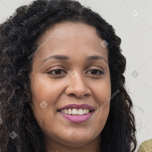 Joyful black young-adult female with long  brown hair and brown eyes