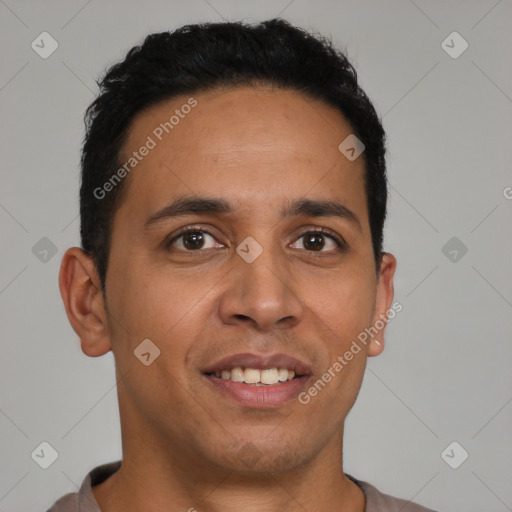 Joyful latino young-adult male with short  brown hair and brown eyes