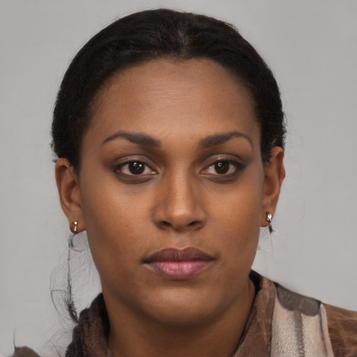 Neutral black young-adult female with short  brown hair and brown eyes