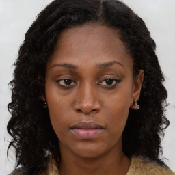 Neutral black young-adult female with long  brown hair and brown eyes