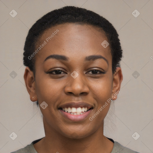 Joyful black young-adult female with short  black hair and brown eyes