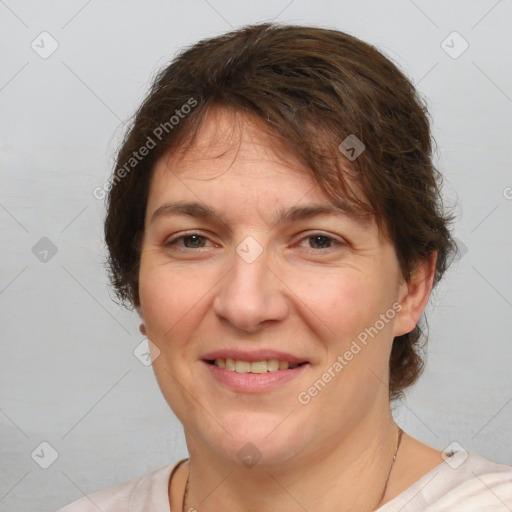 Joyful white adult female with short  brown hair and brown eyes