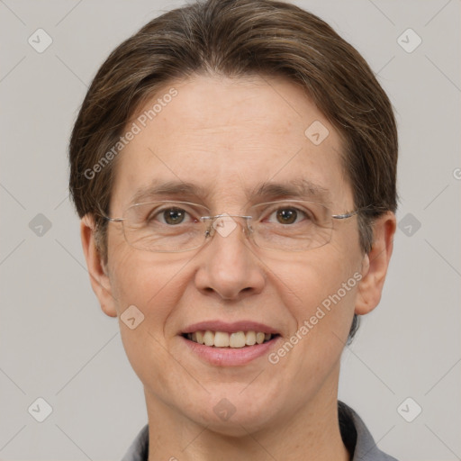 Joyful white adult female with short  brown hair and grey eyes