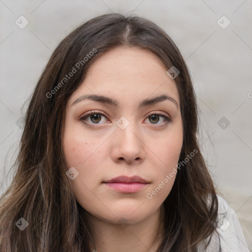 Neutral white young-adult female with long  brown hair and brown eyes