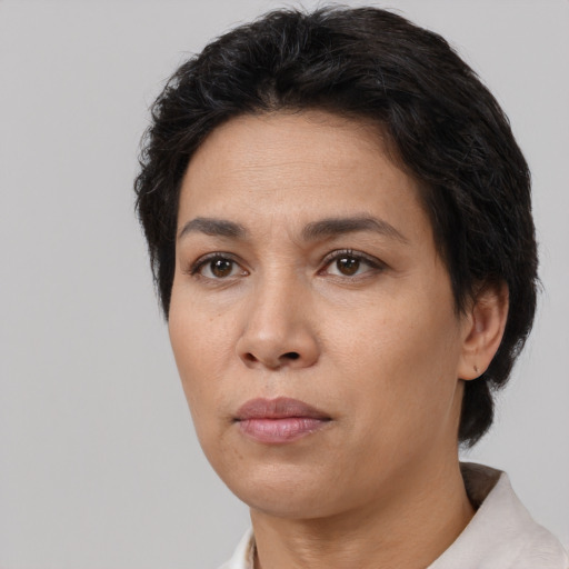 Neutral white adult female with short  black hair and brown eyes