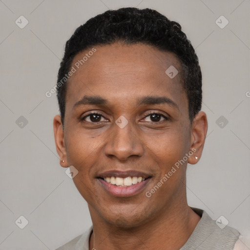 Joyful black young-adult male with short  black hair and brown eyes