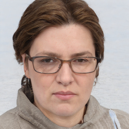 Joyful white adult female with short  brown hair and grey eyes