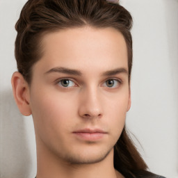 Neutral white young-adult male with long  brown hair and brown eyes