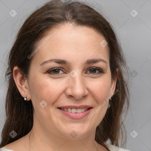 Joyful white adult female with medium  brown hair and brown eyes