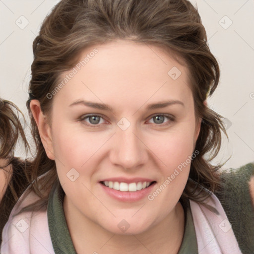 Joyful white young-adult female with medium  brown hair and blue eyes