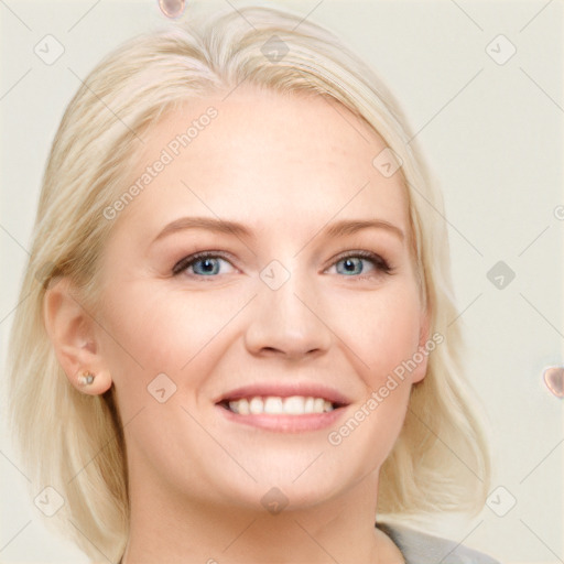 Joyful white young-adult female with medium  blond hair and blue eyes