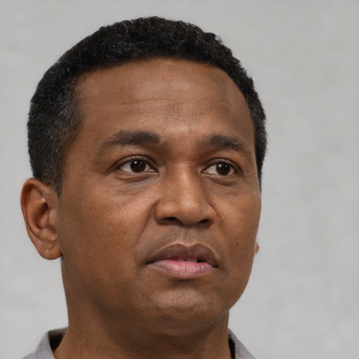 Neutral black young-adult male with short  brown hair and brown eyes