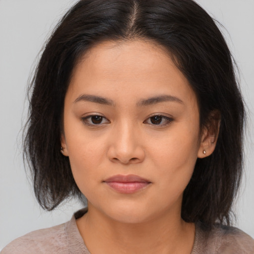 Neutral asian young-adult female with medium  brown hair and brown eyes
