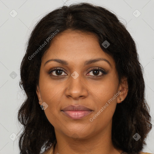 Joyful black young-adult female with long  brown hair and brown eyes